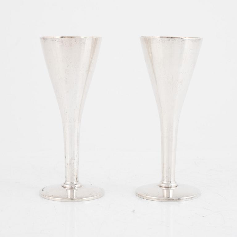 A set of five silver beakers, including MGAB, Stockholm 1946.