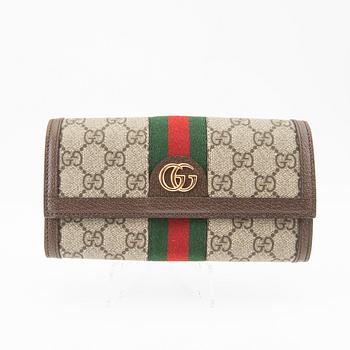 Gucci plånbok.