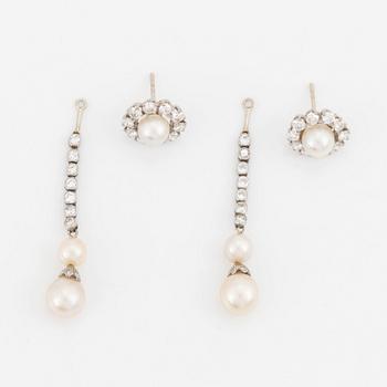 A pair of 18K white gold and cultured bouton pearl earrings set with round brilliant-cut diamonds.