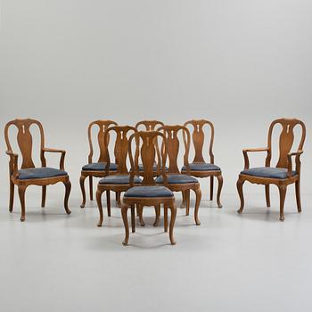 a set of eight rococo-style oak chairs from the 20th century.