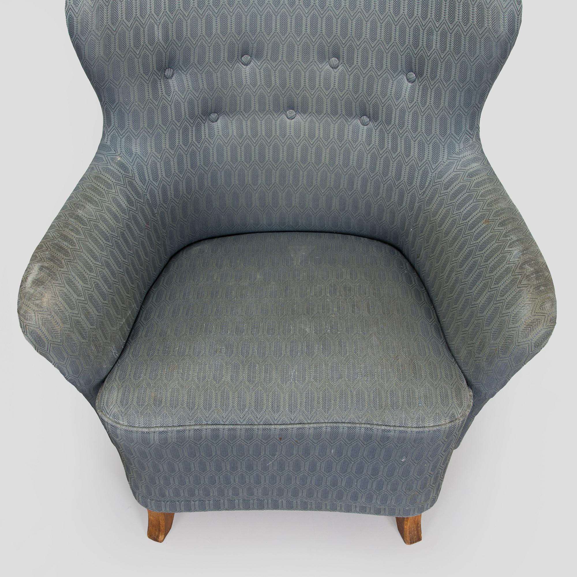 A pair of mid-20th century armchairs.