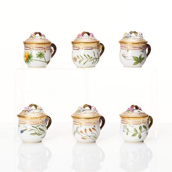 A set of 12 Royal Copenhagen 'Flora Danica' custard cups with covers and stand, Denmark, 20th Century.