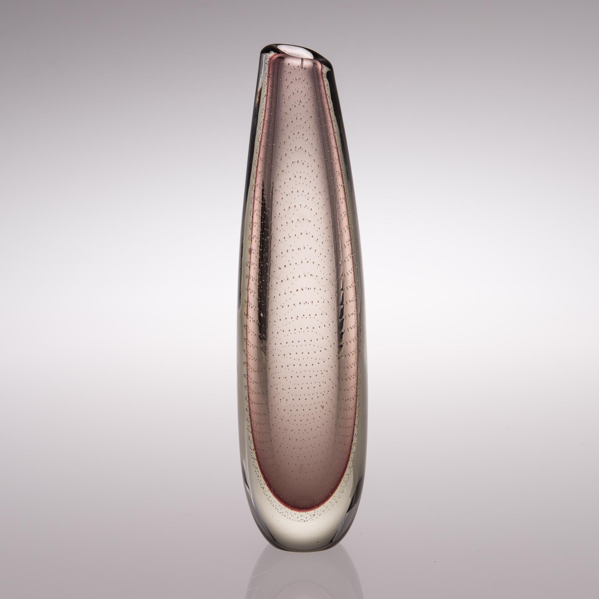 A glass vase signed G. Nyman.