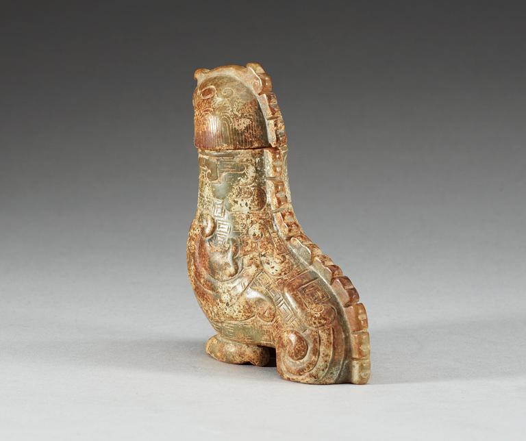 An archaistic nephrite bird shaped covered vessel.