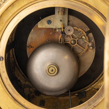 A Louis XVI-style gilt bronze mantel clock, 19th Century.