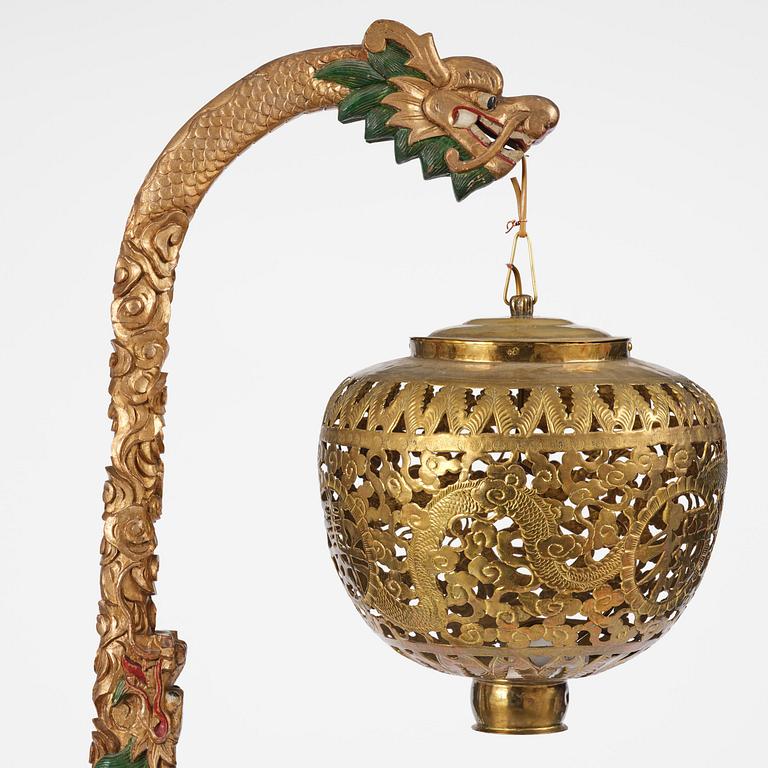 A Chinese gilt wood lantern with brass shade, Qing dynasty, 19th century.
