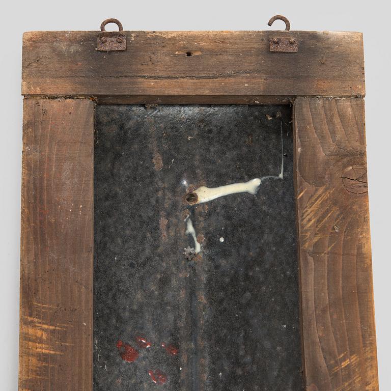 a mid-20th century outdoor thermometer.