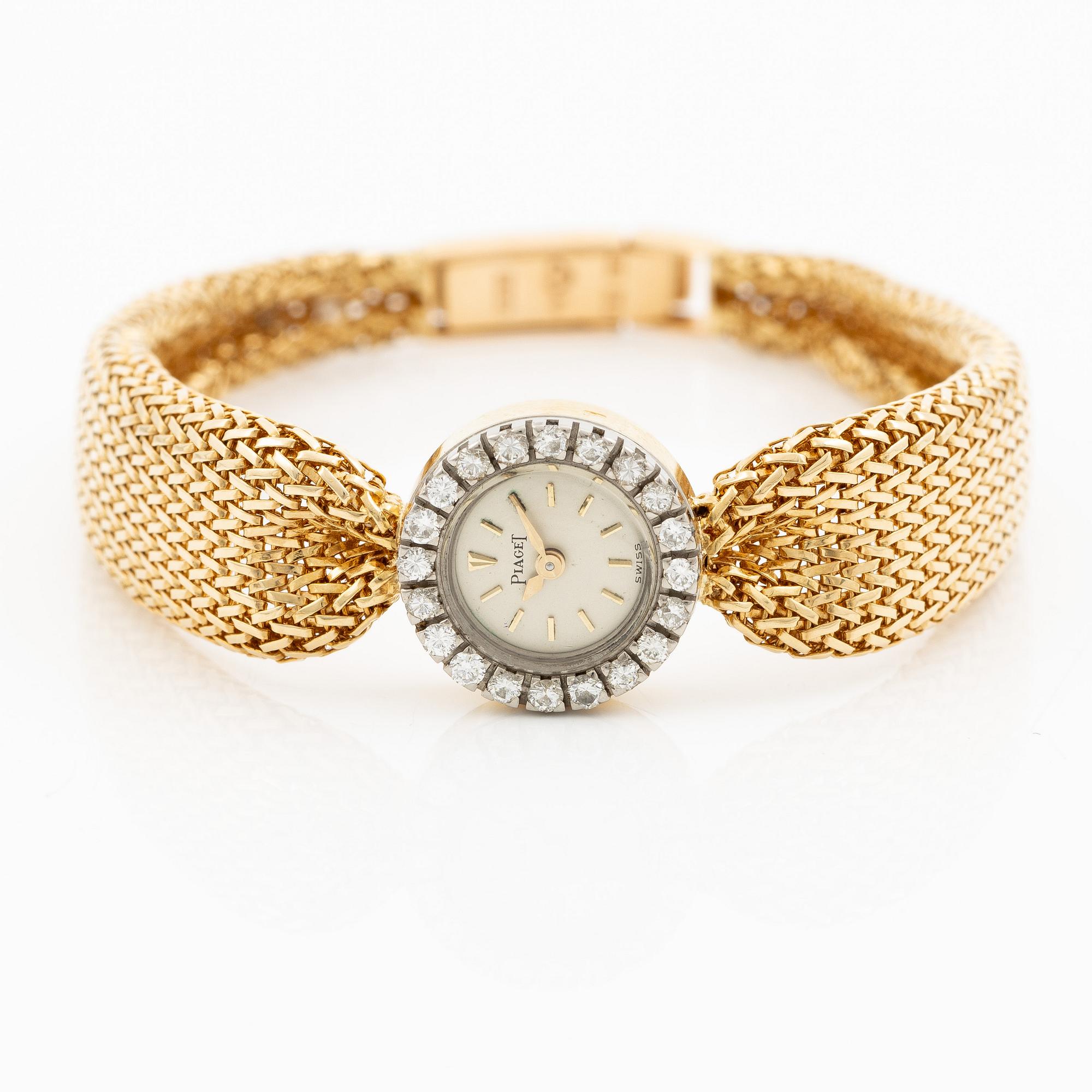 Piaget, armbandsur 18K guld och runda briljantslipade diamanter med länk av W.A. Bolin.
