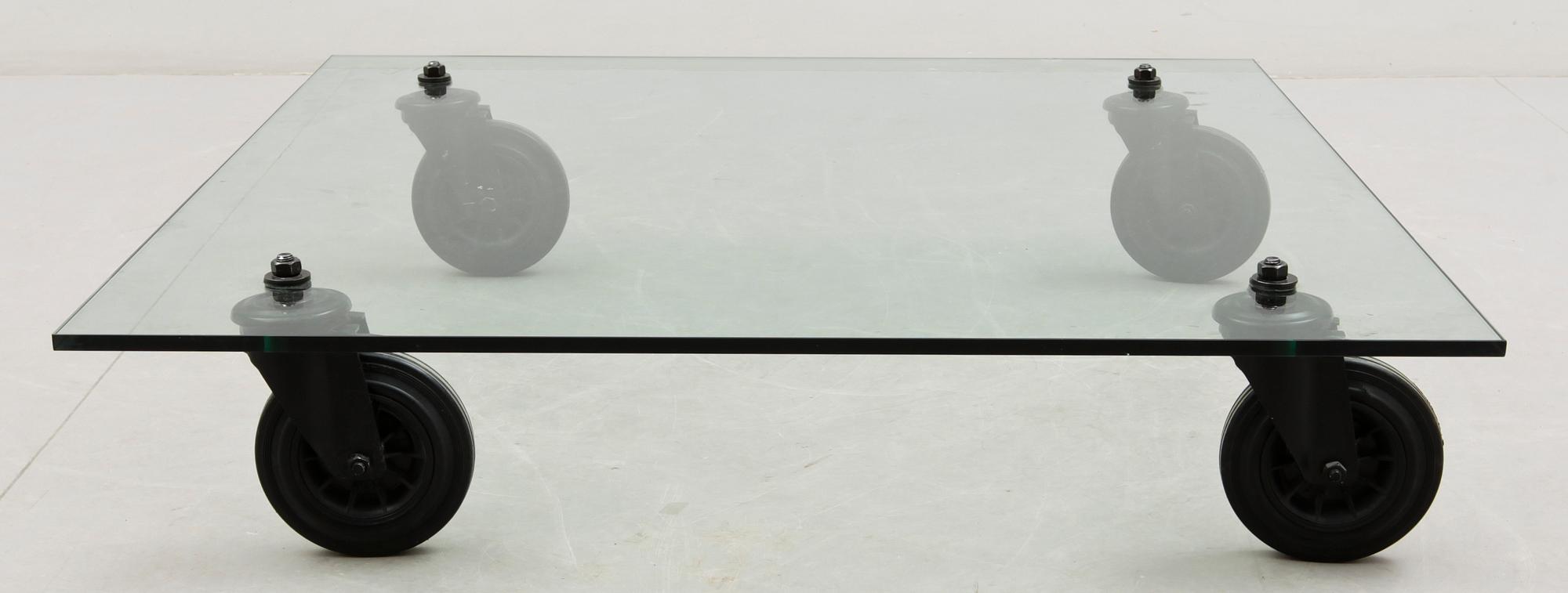 A Gae Aulenti 'Tavola con Ruote' table, Fontana Arte, Italy.