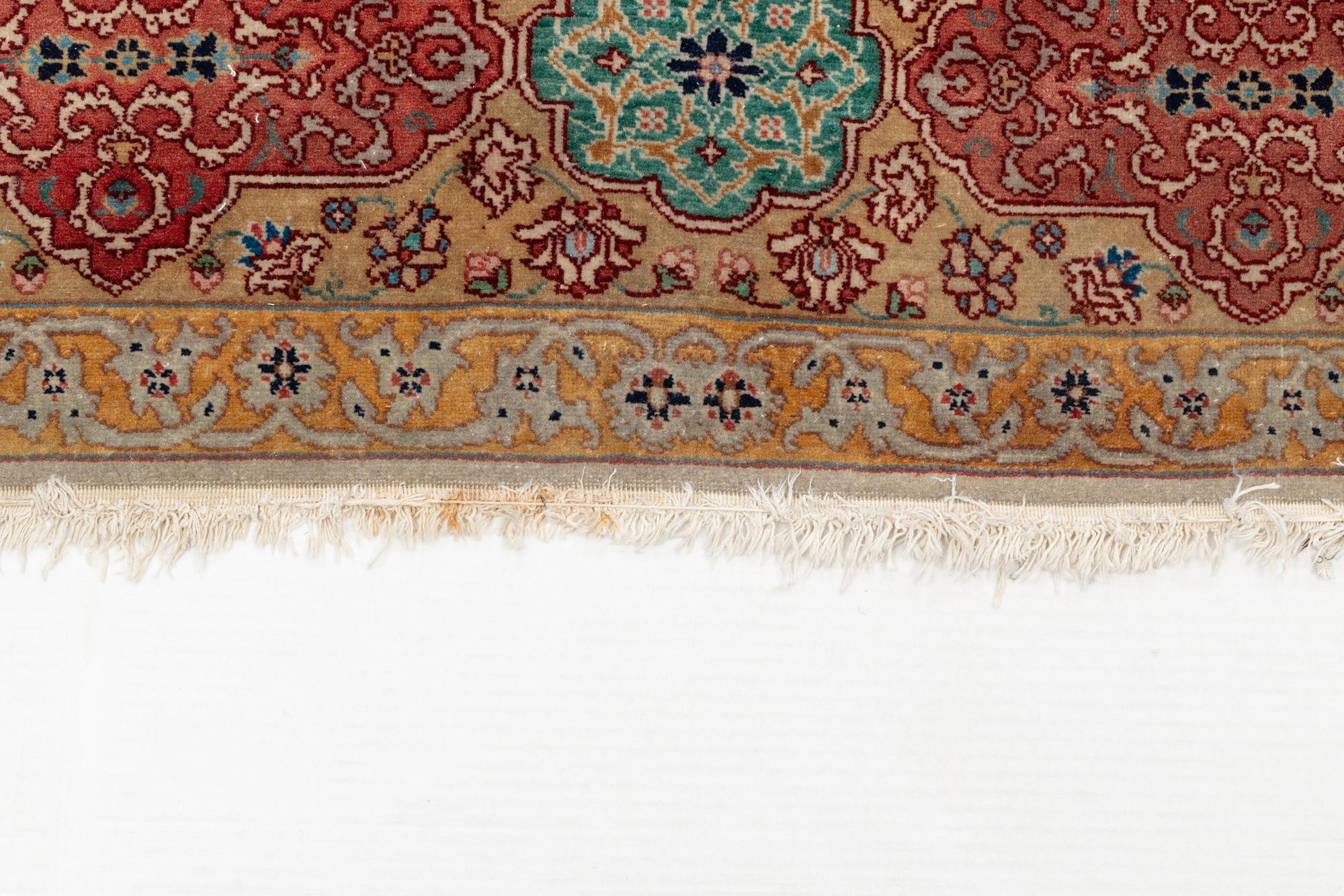 A carpet, semi-antique, Tabriz, ca 298 x  228 cm.