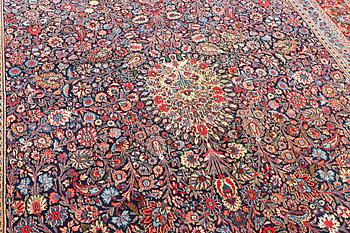 A semi-antique Meshad carpet, a. 360 x 252 cm.