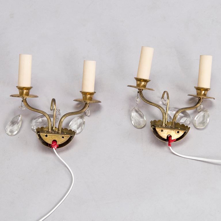 Four of mid-20th century wall sconces.