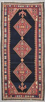 A kelim rug, 342 x 150 cm.