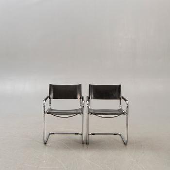 A pair of chrome and leather armchairs lat er part of the 20th century.