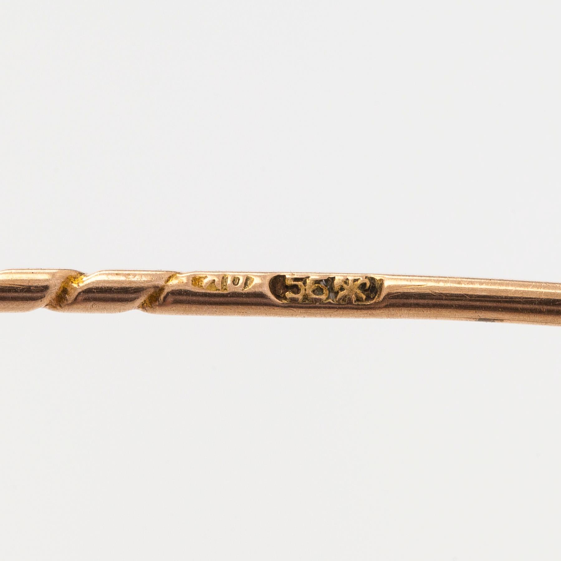 Brooch, faceted pyrope garnet, 14K (56) gold, St. Petersburg, late 19th century.