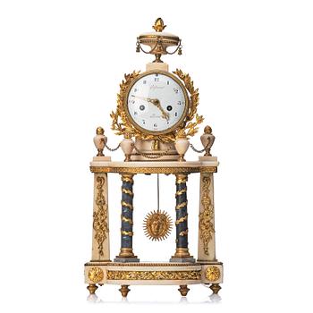 A Louis XVI gilt bronze and white and grey marble mantel clock.
