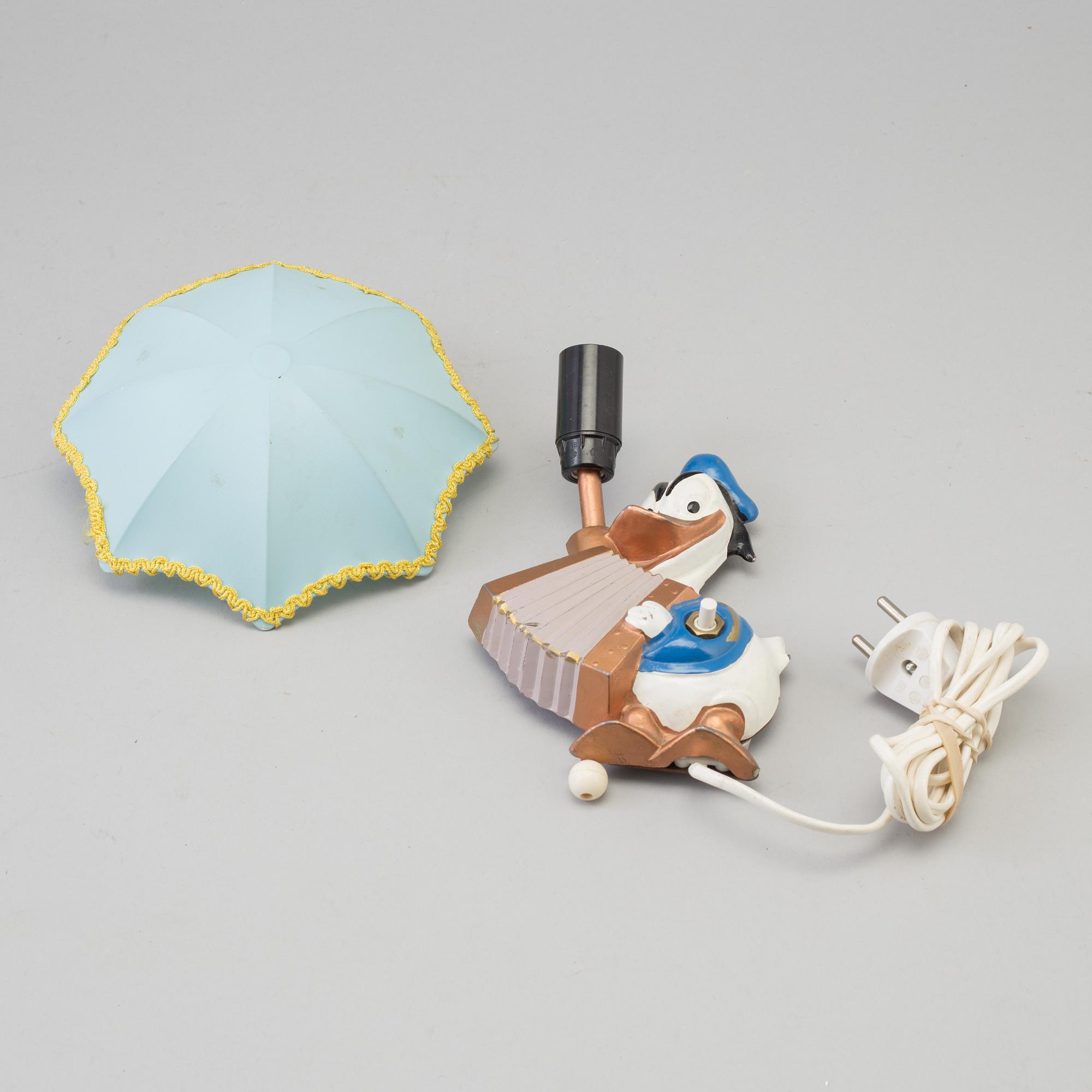 A mid 20th century metal Donald Duck Walt Disney Productions wall light.