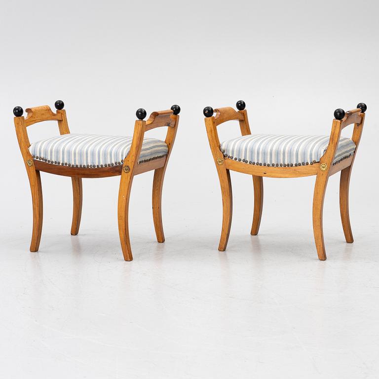 A pair of late Empire stools, mid-19th century.