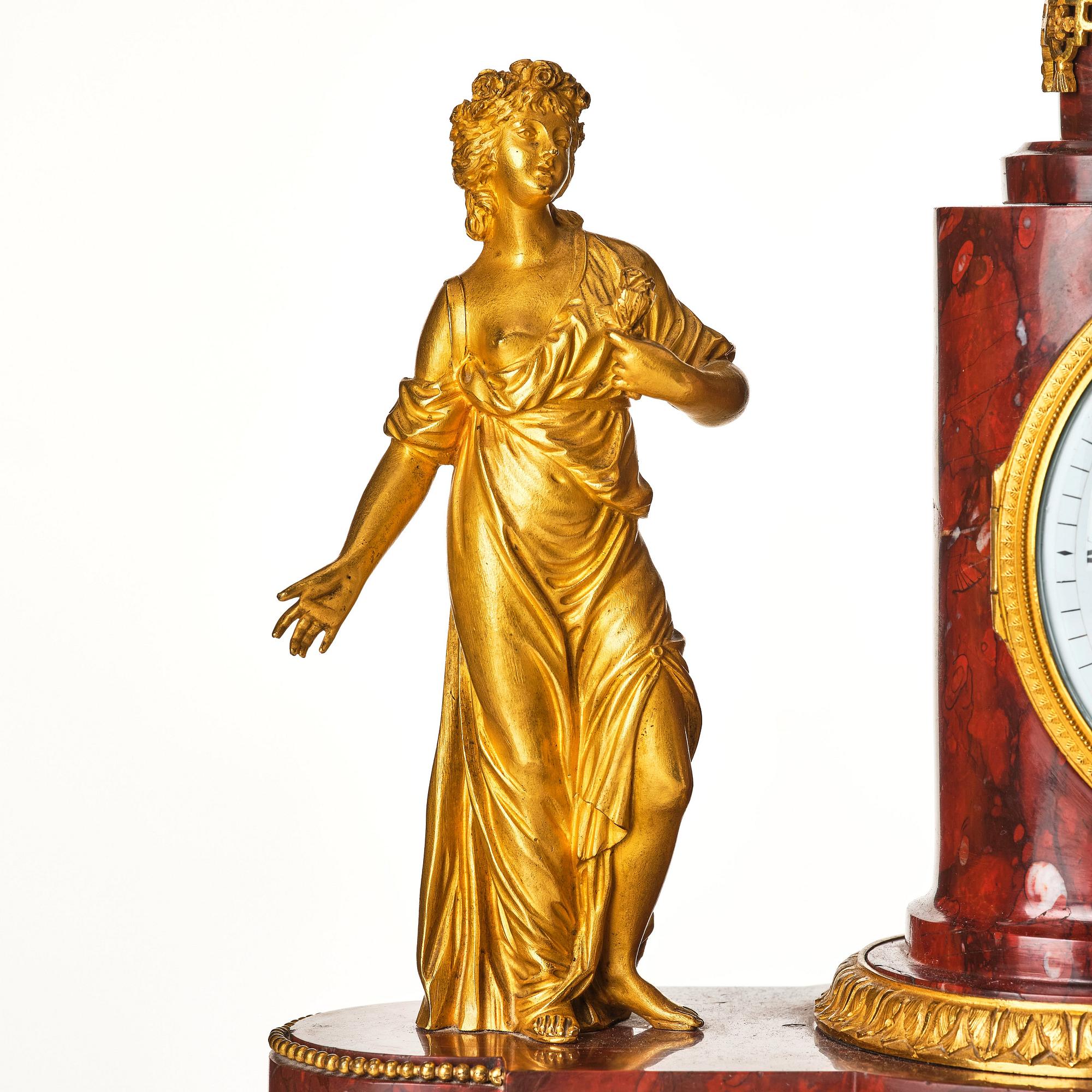 A French Empire 19th century gilt bronze mantel clock signed Lamiral.