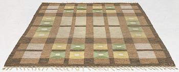 A flat weave carpet, signed, ca. 243 x 165 cm.