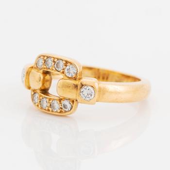 An 18K gold Cartier ring set with round brilliant-cut diamonds.