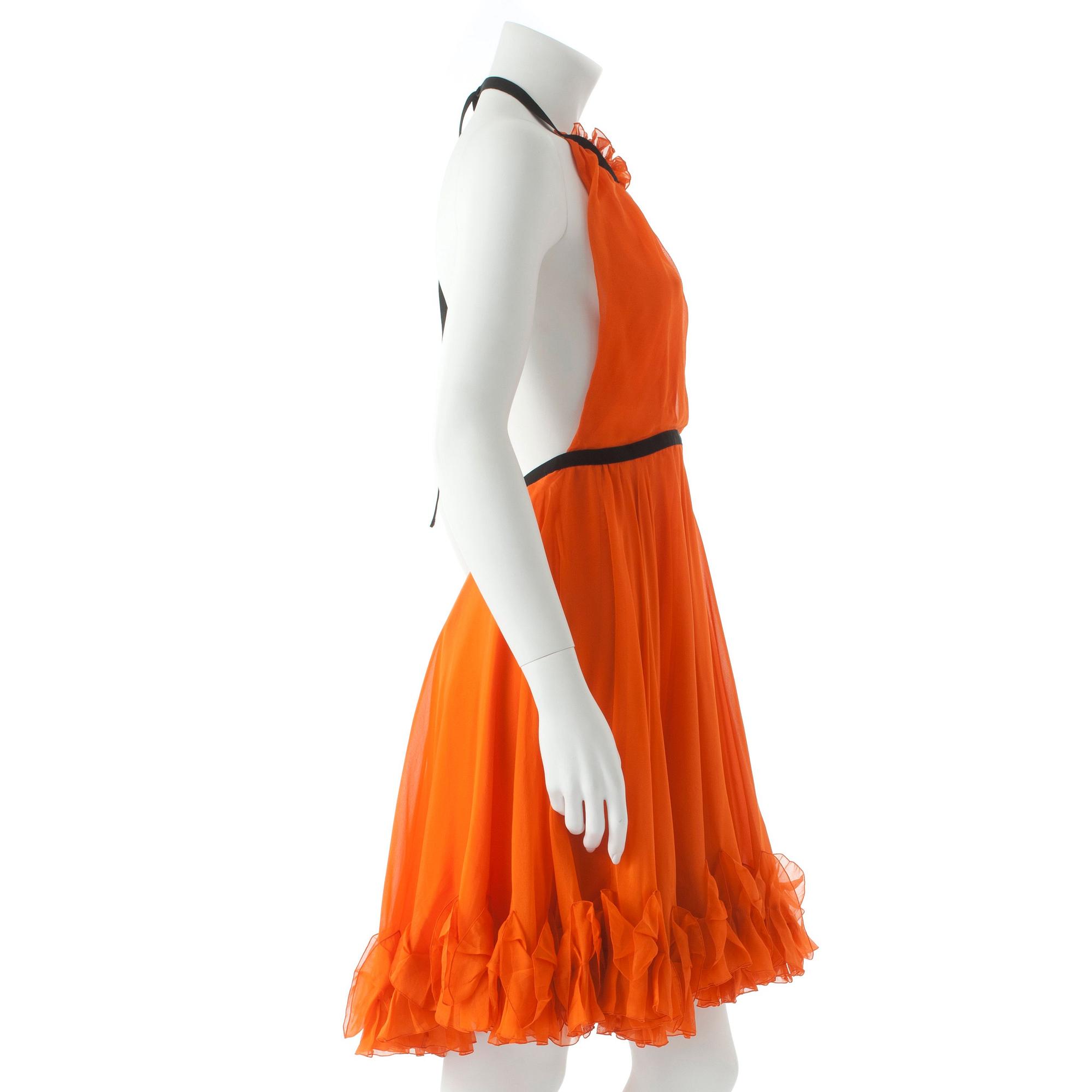 DOLCE & GABBANA, an orange silk cocktail dress.
