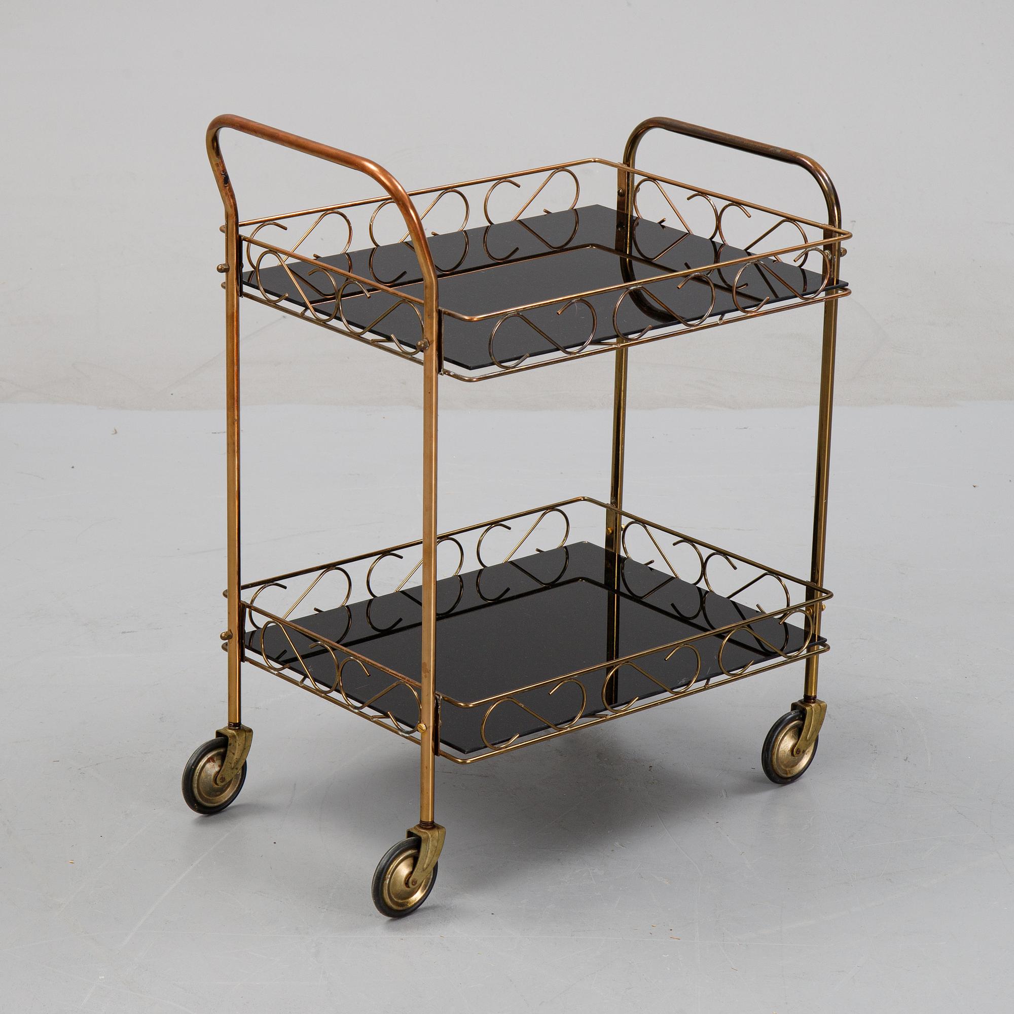 A brass and glass serving trolley, later part of the 20th Century.