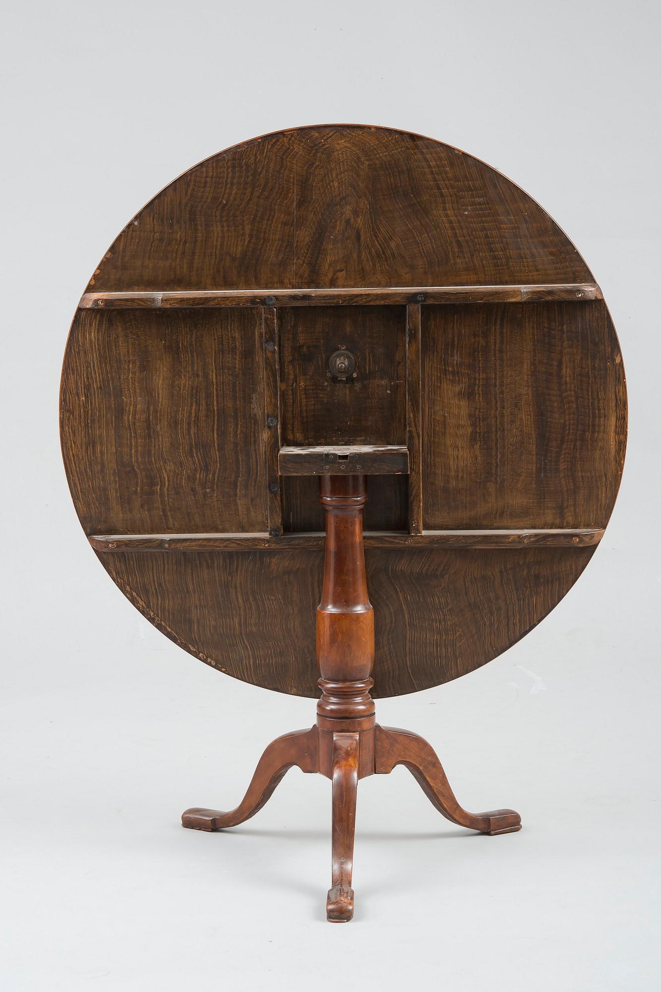 A TILT-TOP TABLE.