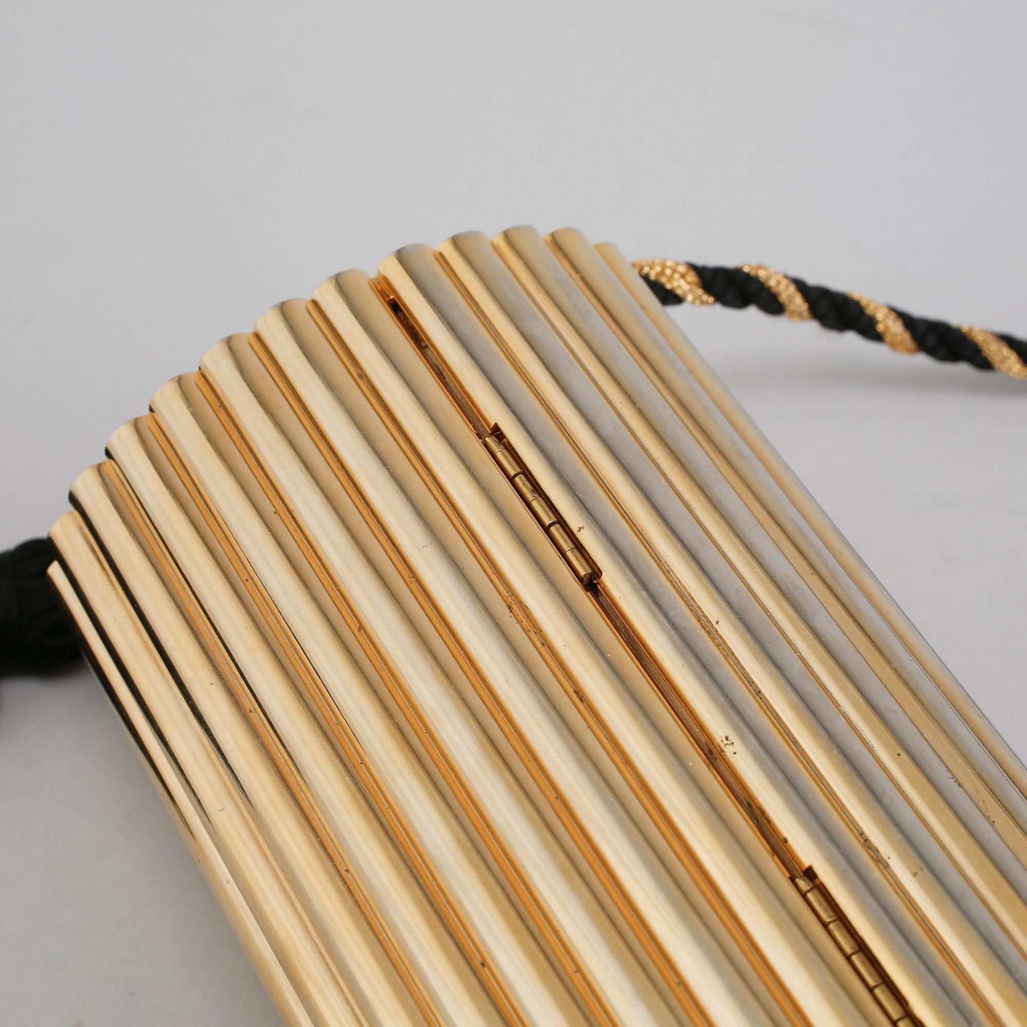 AFTONVÄSKA, "Gold Tassel Clutch", Yves Saint Laurent.