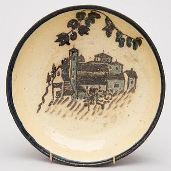 A ceramic bowl, signed GT.