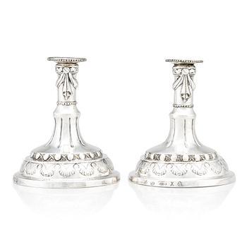 A pair of Swedish silver candlesticks, marks of Sigismund Novisadi the younger, Karlskrona 1780.