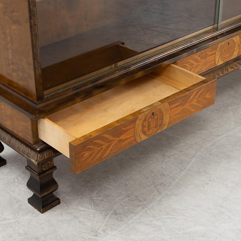A stained birch veneered book cabinet, first half of the 20th Century.