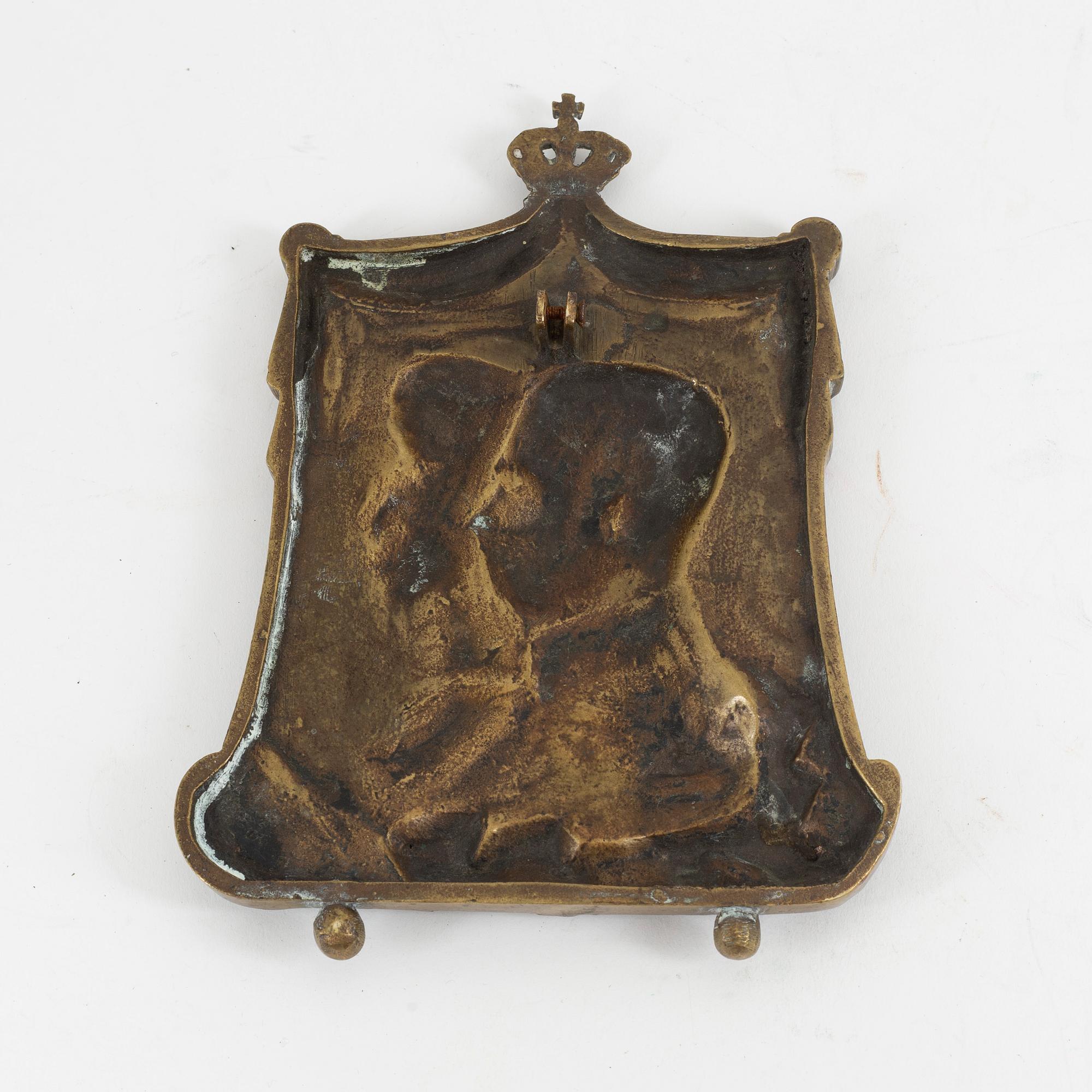 A 19th century bronze plaque.