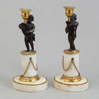 A pair of late gustavian candlesticks from around year 1800.