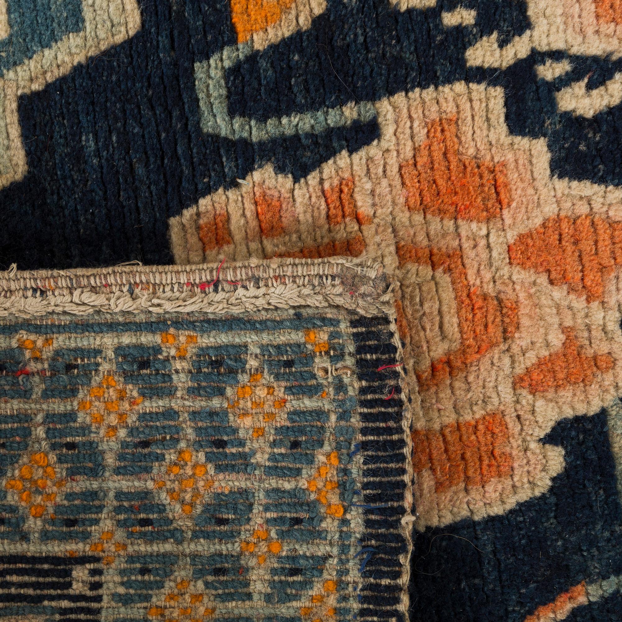 A semaintique Chinese carpet ca 73 x 54 cm.