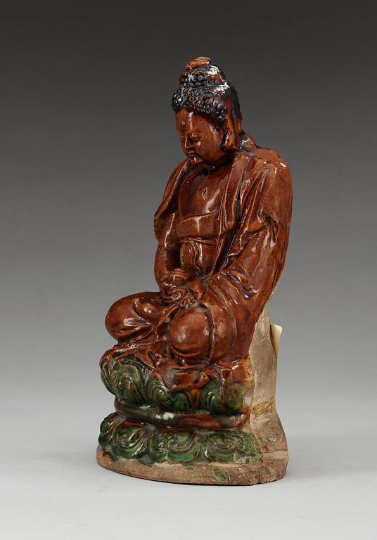 A ceramic figure of Buddha, Ming dynasty, 17th Century.