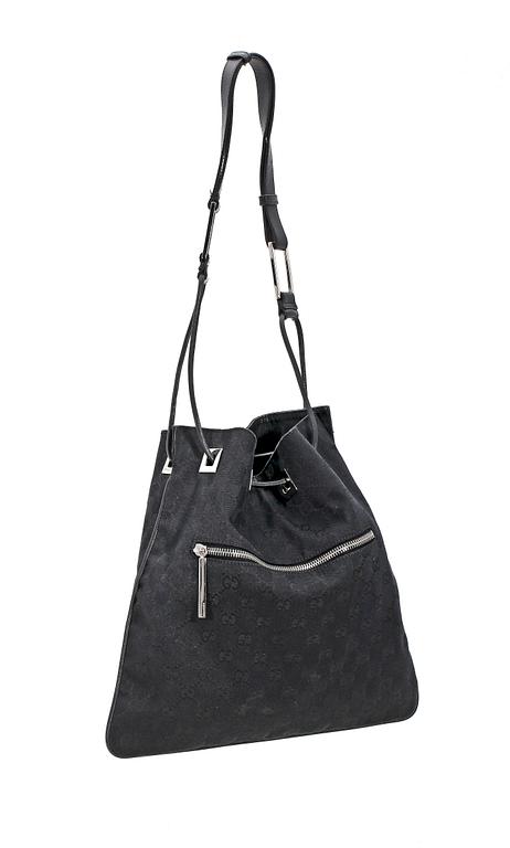 A black monogram canvas shoulder bag by Gucci.