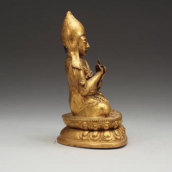 A Sino-Tibetan gilt copper alloy repoussé figure of Tsong Khapa, 18/19th Century.