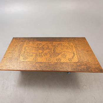 A 1970s copper coffee table.