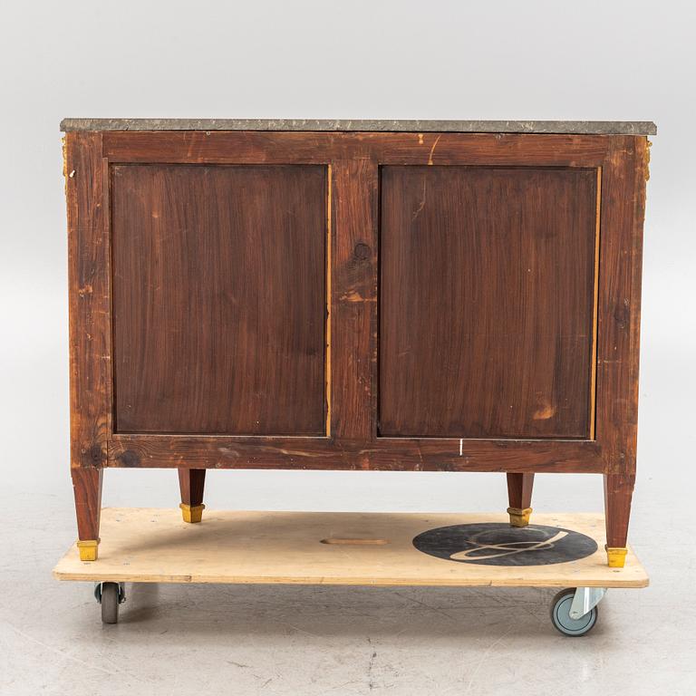 A Gustavian style cabinet with a stone top, 20th century.