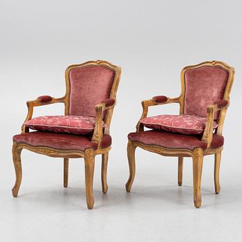 A pair of rococo style armchairs, 20th Century.