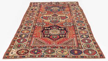 An antique Konya long rug, c. 324 x 144 cm.