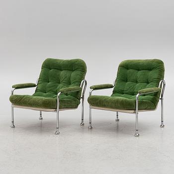 Bo Eigert, a pair of "Stålbo" armchairs, Firma B. Eigert AB, Hova, Sweden, 1970's.