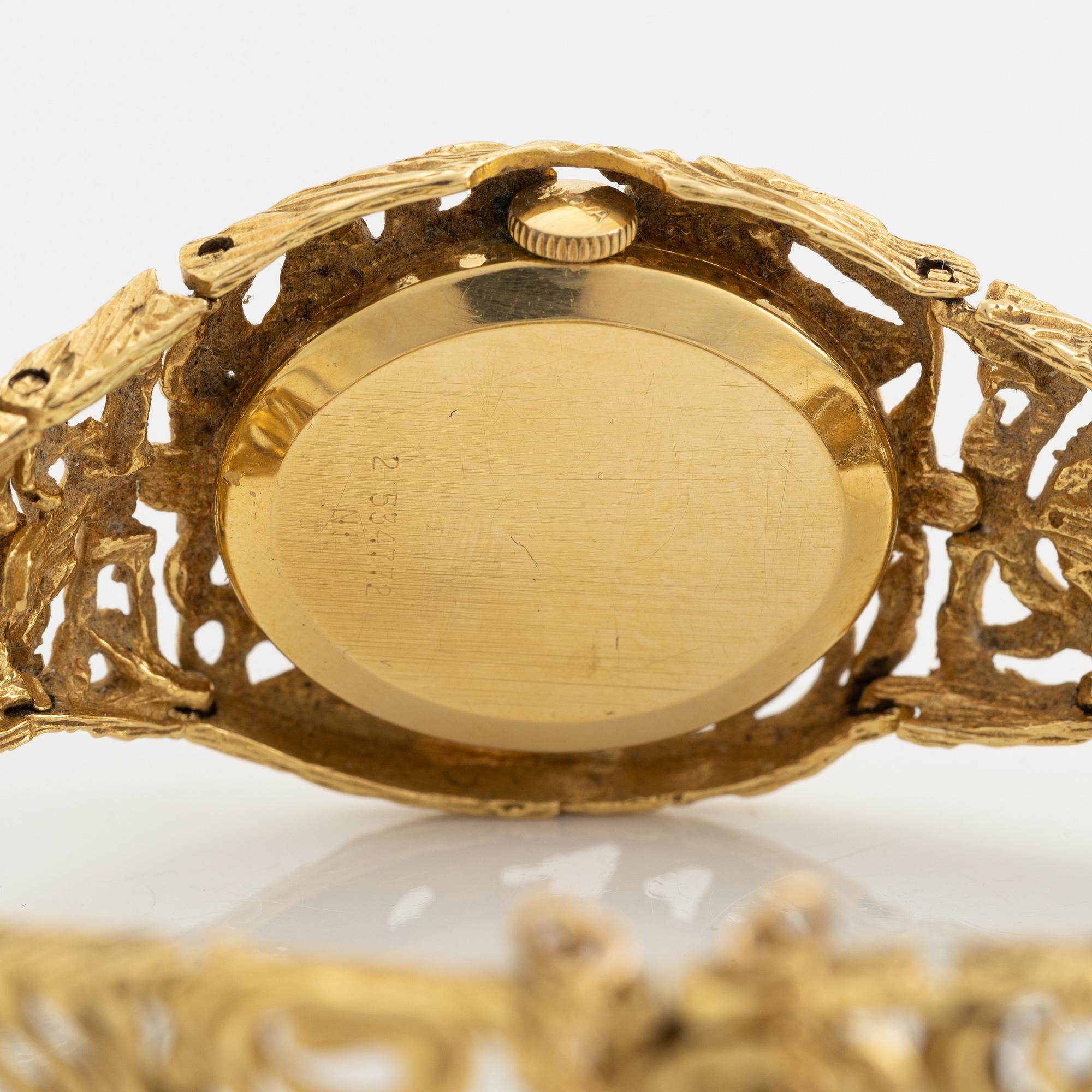 18K gold Bulova watch.