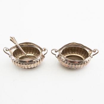 A pair of salt cellars and a spoon, silver, Minshull & Latimer, Birmingham, 1899.