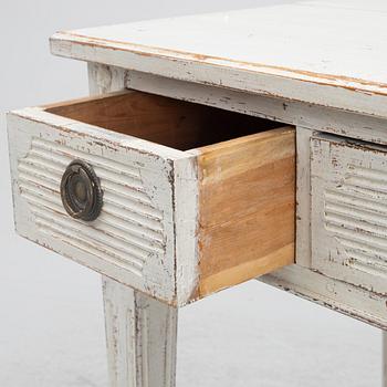 A late 19th century desk and an "Odenslunda" chair from IKEAs 18th century series.