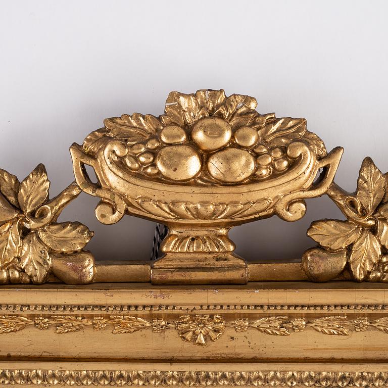 A pair of Swedish Empire mirror wall sconces, first half of the 19th century.