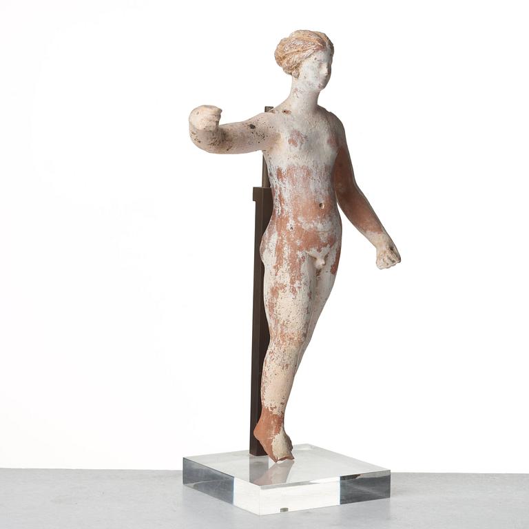 A Greek terracottta scultpure of Eros, Hellenistic period, Canosa, probably circa 3rd Century A.D.