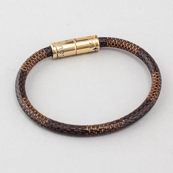 A bracelet by Louis Vuitton.