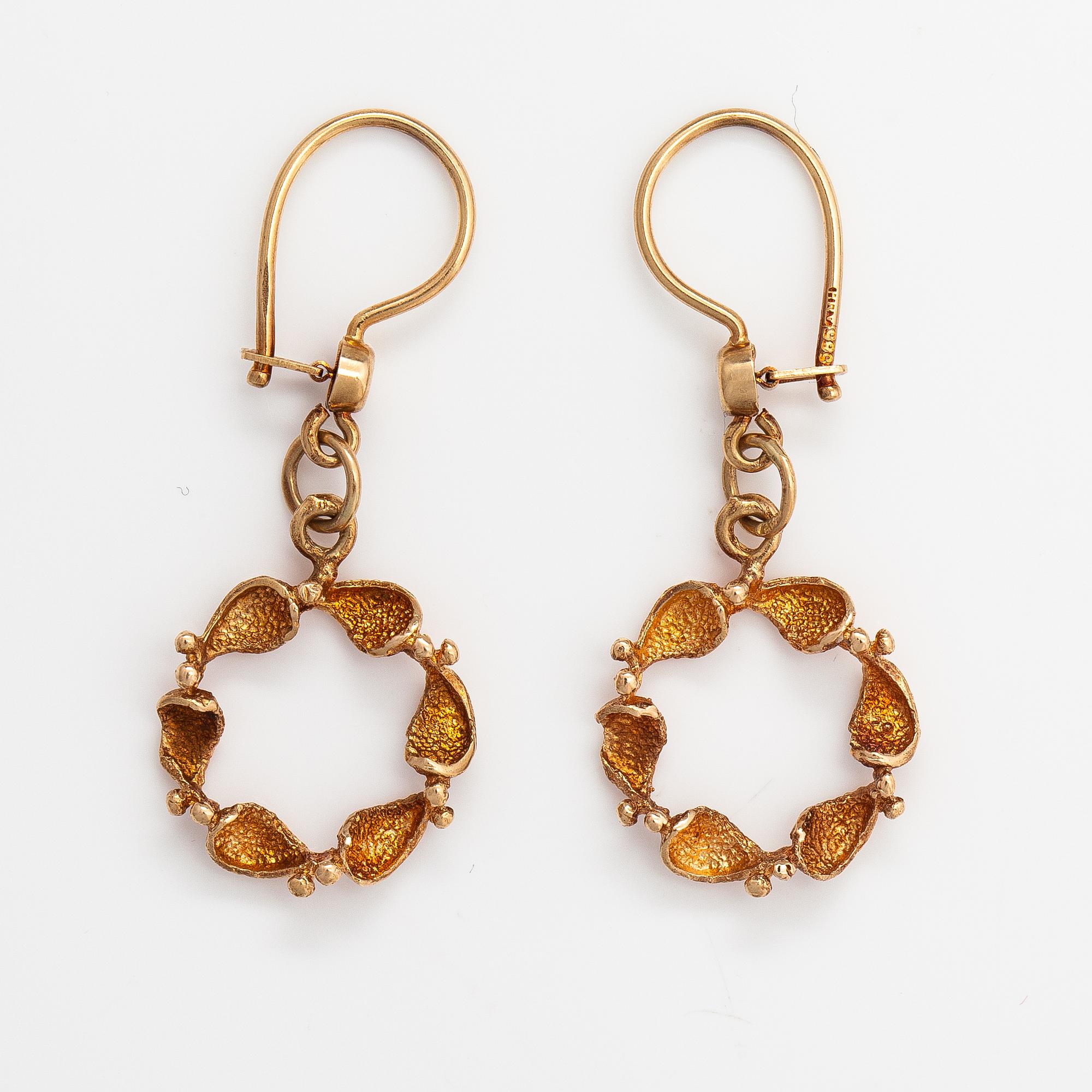 A pair of 14K gold earrings.